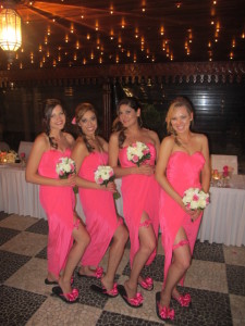 Four Bridesmaids in hot pink dresses, wearing their matching Bridal Flip Flops