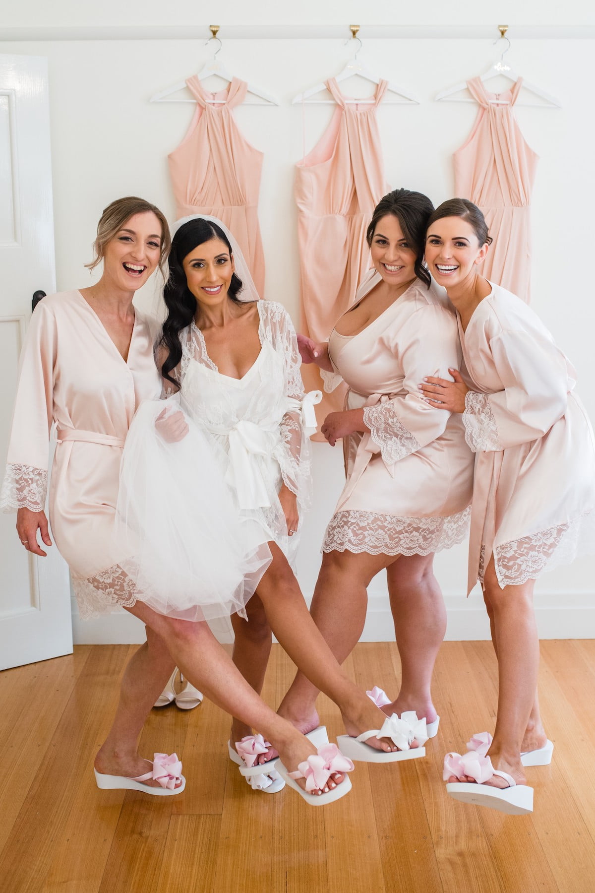 Bride and Bridesmaids wearing their Bridal Flip Flops