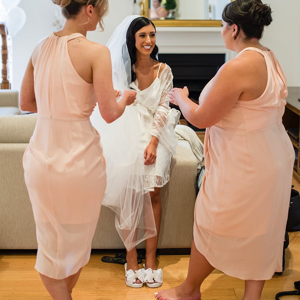 Bride wearing Bridal Flip Flops with her Bridesmaids