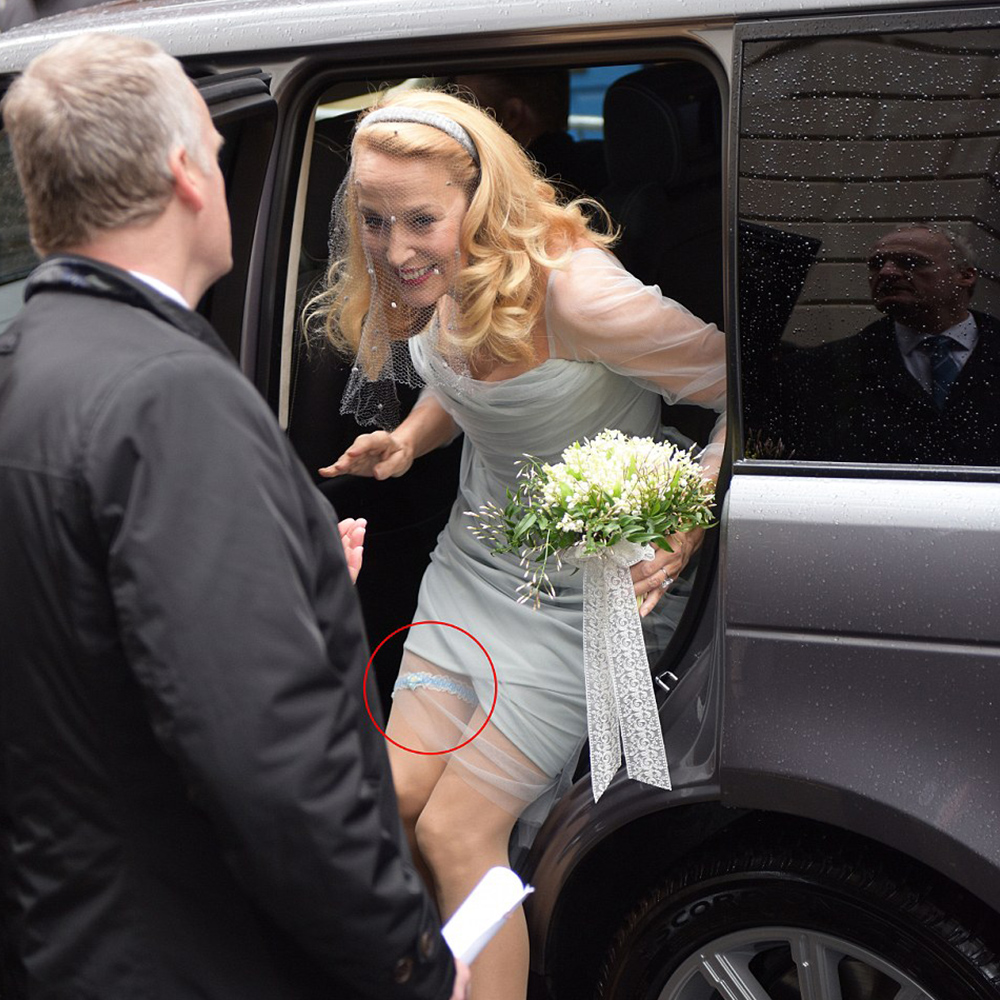 Jerry Hall wearing a blue garter