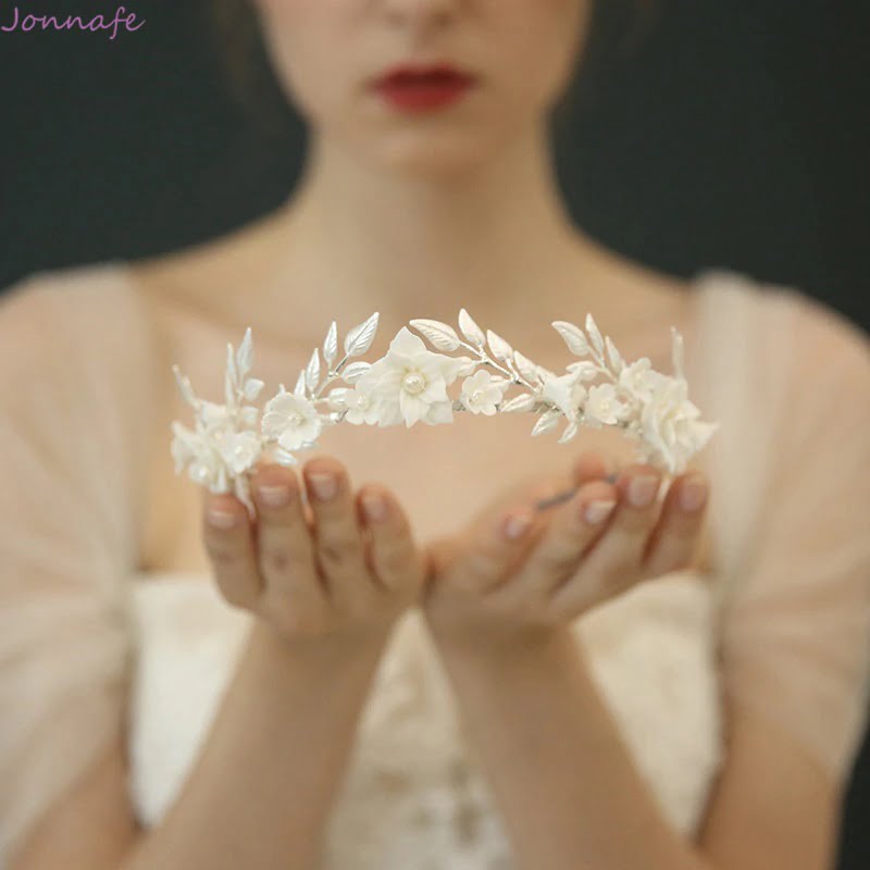 Delicate white porcelain flower and leaf wedding crown
